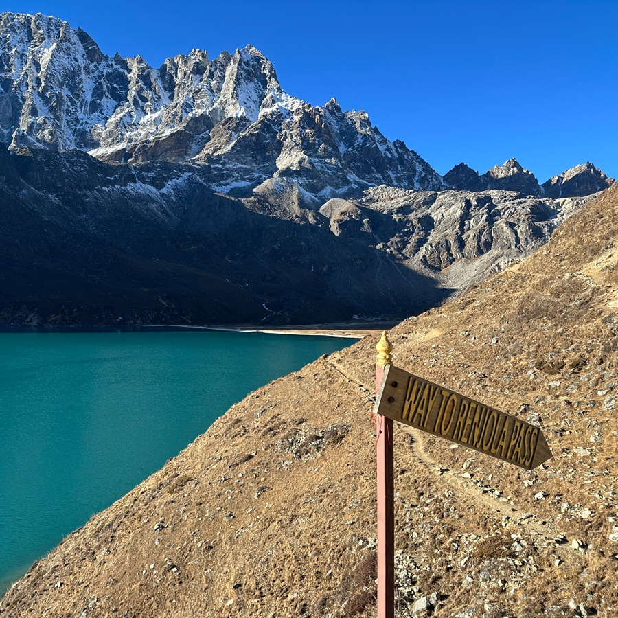 Sign pointing the way past lake 